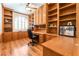 Spacious office features custom built-ins and large windows that allow for plenty of natural light at 7540 Flowing Stream Dr, Las Vegas, NV 89131
