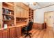 Inviting office space featuring custom built-ins, ample storage, and a comfortable work area at 7540 Flowing Stream Dr, Las Vegas, NV 89131