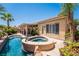 Lush backyard oasis with a sparkling pool, spa, and inviting patio, perfect for relaxation at 7540 Flowing Stream Dr, Las Vegas, NV 89131