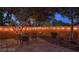 Enchanting backyard with flagstone patio, string lights, and a quaint dining set, perfect for evening gatherings at 7728 Whispering River St, Las Vegas, NV 89131