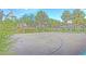 A basketball court with trees around it offers a great place for recreation and exercise at 7728 Whispering River St, Las Vegas, NV 89131