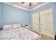 Comfortable bedroom features bright paint, a queen bed and two large closets at 7728 Whispering River St, Las Vegas, NV 89131