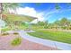 Beautiful park featuring a covered picnic area, playground, and lush green space, perfect for outdoor recreation at 7728 Whispering River St, Las Vegas, NV 89131
