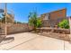 Backyard featuring a concrete patio, block wall, metal stairs, and desert landscaping at 8041 Astrology Ct # 201, Las Vegas, NV 89128