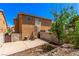 The backyard features a spiral staircase, providing access to the upper level, and has a concrete patio area at 8041 Astrology Ct # 201, Las Vegas, NV 89128