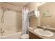 Bathroom showcasing a shower-tub combo, vanity, and neutral decor for a serene atmosphere at 8041 Astrology Ct # 201, Las Vegas, NV 89128
