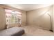 Bright bedroom with a window view, red striped curtains, carpeted floor, and a cozy bed at 8041 Astrology Ct # 201, Las Vegas, NV 89128