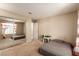 Bedroom with mirrored closet doors, carpeted floor, and view to a clean adjoining bathroom at 8041 Astrology Ct # 201, Las Vegas, NV 89128
