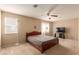 Bedroom with neutral tones, ceiling fan, and large windows at 8041 Astrology Ct # 201, Las Vegas, NV 89128