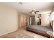 Bedroom featuring a ceiling fan, closet, and bathroom at 8041 Astrology Ct # 201, Las Vegas, NV 89128