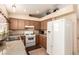 Well-lit kitchen with cabinets, gas range, and a refrigerator at 8041 Astrology Ct # 201, Las Vegas, NV 89128