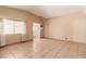 Open floor plan shows tile flooring throughout, with bright light from the large front windows at 8041 Astrology Ct # 201, Las Vegas, NV 89128