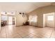 Bright, open floor plan with neutral walls and tile flooring and a partial wall to define space at 8041 Astrology Ct # 201, Las Vegas, NV 89128