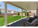 Spacious backyard with artificial turf, covered patio, and privacy fence at 8061 Palace Estate Ave, Las Vegas, NV 89117