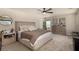 Spacious bedroom boasts a neutral palette, plush carpet, and plenty of natural light at 8061 Palace Estate Ave, Las Vegas, NV 89117