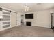 Bright bedroom with a barn door closet and tv on the wall at 8061 Palace Estate Ave, Las Vegas, NV 89117