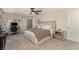 Relaxing bedroom with a plush bed, modern furnishings, carpet, and ample natural light at 8061 Palace Estate Ave, Las Vegas, NV 89117