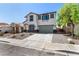 Beautiful two-story home boasting a well-kept lawn, rock garden, and convenient two-car garage at 8061 Palace Estate Ave, Las Vegas, NV 89117