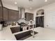 Well-equipped kitchen featuring gray backsplash, stainless steel appliances, and light countertops at 8061 Palace Estate Ave, Las Vegas, NV 89117