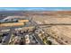 Sweeping aerial view of homes in a community near open land, with mountain views in the background at 816 Sandsprings St, Henderson, NV 89011