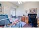 Cozy bedroom featuring a bright window and a comfortable bed and desk at 816 Sandsprings St, Henderson, NV 89011
