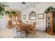 Traditional dining room featuring wood table, chairs, grandfather clock, and decorative mirror at 816 Sandsprings St, Henderson, NV 89011