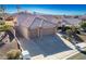 Inviting exterior elevation features a well-manicured yard and a spacious three-car garage at 816 Sandsprings St, Henderson, NV 89011
