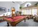 Spacious game room featuring a billiard table, comfortable seating, and ample lighting at 816 Sandsprings St, Henderson, NV 89011
