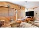 Cozy living room with wood paneling, comfortable seating, and a large TV screen at 816 Sandsprings St, Henderson, NV 89011