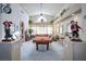 Spacious living room featuring a pool table, high ceilings, and bright natural light at 816 Sandsprings St, Henderson, NV 89011