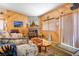 Comfortable living room with fireplace, wood-paneled walls, and cozy seating at 816 Sandsprings St, Henderson, NV 89011