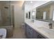 Large bathroom featuring double vanity, walk-in glass shower, and tile floors at 851 Brahma Ln, Henderson, NV 89002