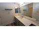 Bathroom with a sink, countertop, and large mirror at 851 Brahma Ln, Henderson, NV 89002