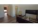 Bright bedroom with wood floors, walk-in closet, and chair at 851 Brahma Ln, Henderson, NV 89002