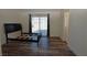 This spacious bedroom features wood floors and a sliding glass door to the back yard at 851 Brahma Ln, Henderson, NV 89002