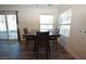 The dining area has wood-look floors, natural light, and a view of backyard at 851 Brahma Ln, Henderson, NV 89002