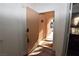 Welcoming entryway showcasing a rustic door, textured walls, and a glimpse of the home's exterior at 851 Brahma Ln, Henderson, NV 89002