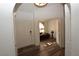 Bright entryway with hardwood flooring, leading to a living area, and featuring a modern door at 851 Brahma Ln, Henderson, NV 89002