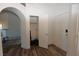 Open entryway with hardwood floors leads to closet storage and kitchen area at 851 Brahma Ln, Henderson, NV 89002