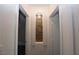 Hallway with decorative wall niche with rock feature between doorways at 851 Brahma Ln, Henderson, NV 89002