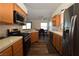 This kitchen features modern appliances and is open to the dining area at 851 Brahma Ln, Henderson, NV 89002