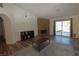 Open living room showcases a stone fireplace, hardwood floors, and sliding glass doors at 851 Brahma Ln, Henderson, NV 89002