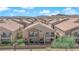 A rear aerial view displays a community with desert mountain backdrops at 8658 Tom Noon Ave # 103, Las Vegas, NV 89178