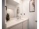 Stylish bathroom featuring a modern vanity, framed decor, and neutral color scheme at 9256 Alden Pointe Ct, Las Vegas, NV 89143