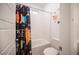 Bright bathroom with a tub, colorful space-themed shower curtain, and toilet at 9256 Alden Pointe Ct, Las Vegas, NV 89143