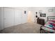 Spacious bedroom with soft gray carpet, closet, and stylish furniture and decor at 9256 Alden Pointe Ct, Las Vegas, NV 89143