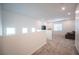 A versatile bonus room filled with natural light and plush carpeting at 9256 Alden Pointe Ct, Las Vegas, NV 89143