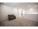 A versatile bonus room featuring plush carpeting, ideal for a game room or home theater at 9256 Alden Pointe Ct, Las Vegas, NV 89143
