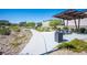 A community park features walking paths, mature trees, benches, and picnic tables at 9256 Alden Pointe Ct, Las Vegas, NV 89143