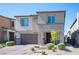 Attractive two-story home with stone veneer, a two-car garage, and a brick paver driveway at 9256 Alden Pointe Ct, Las Vegas, NV 89143